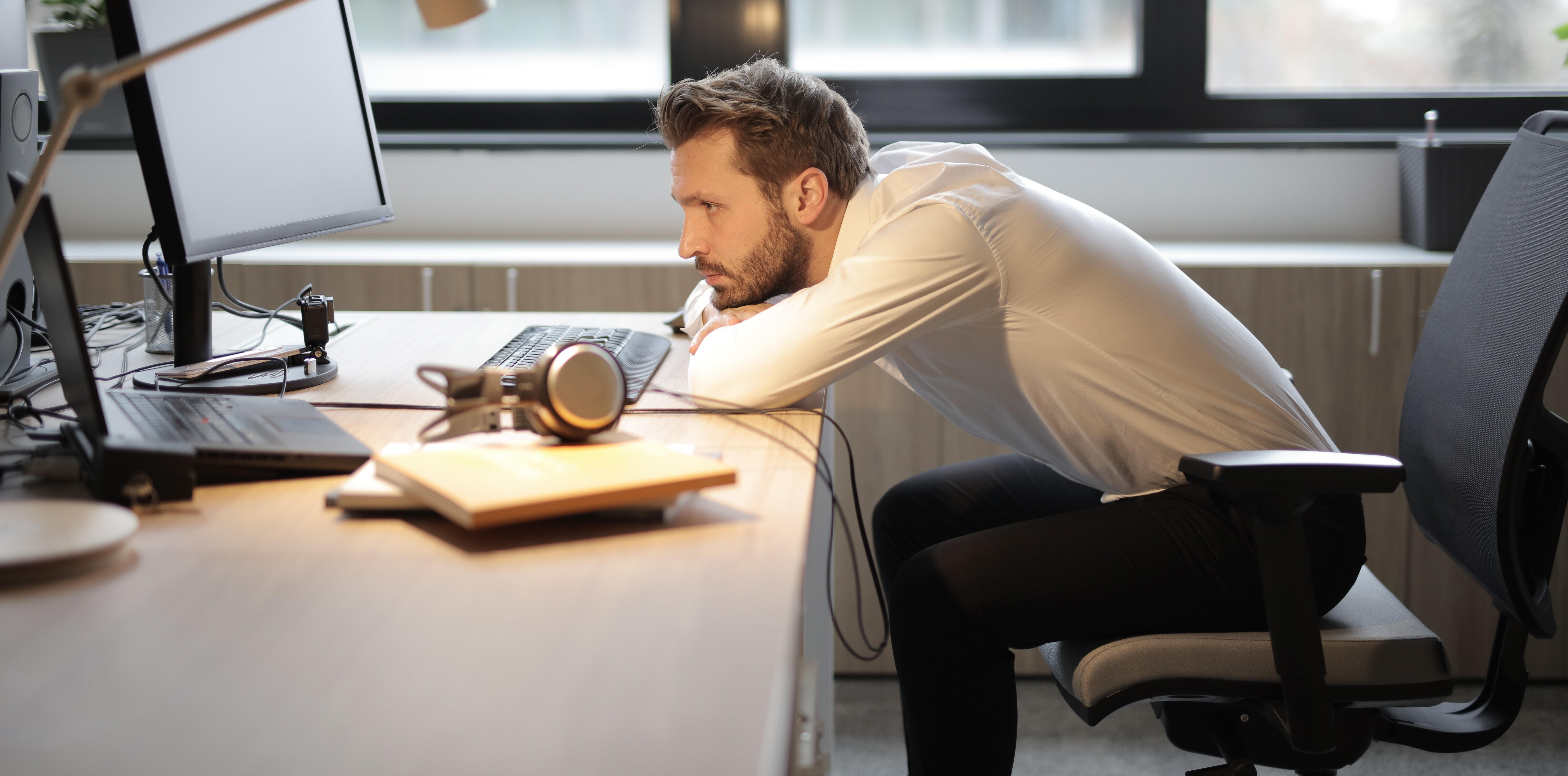 Canva - Man in White Shirt Sitting on Chair