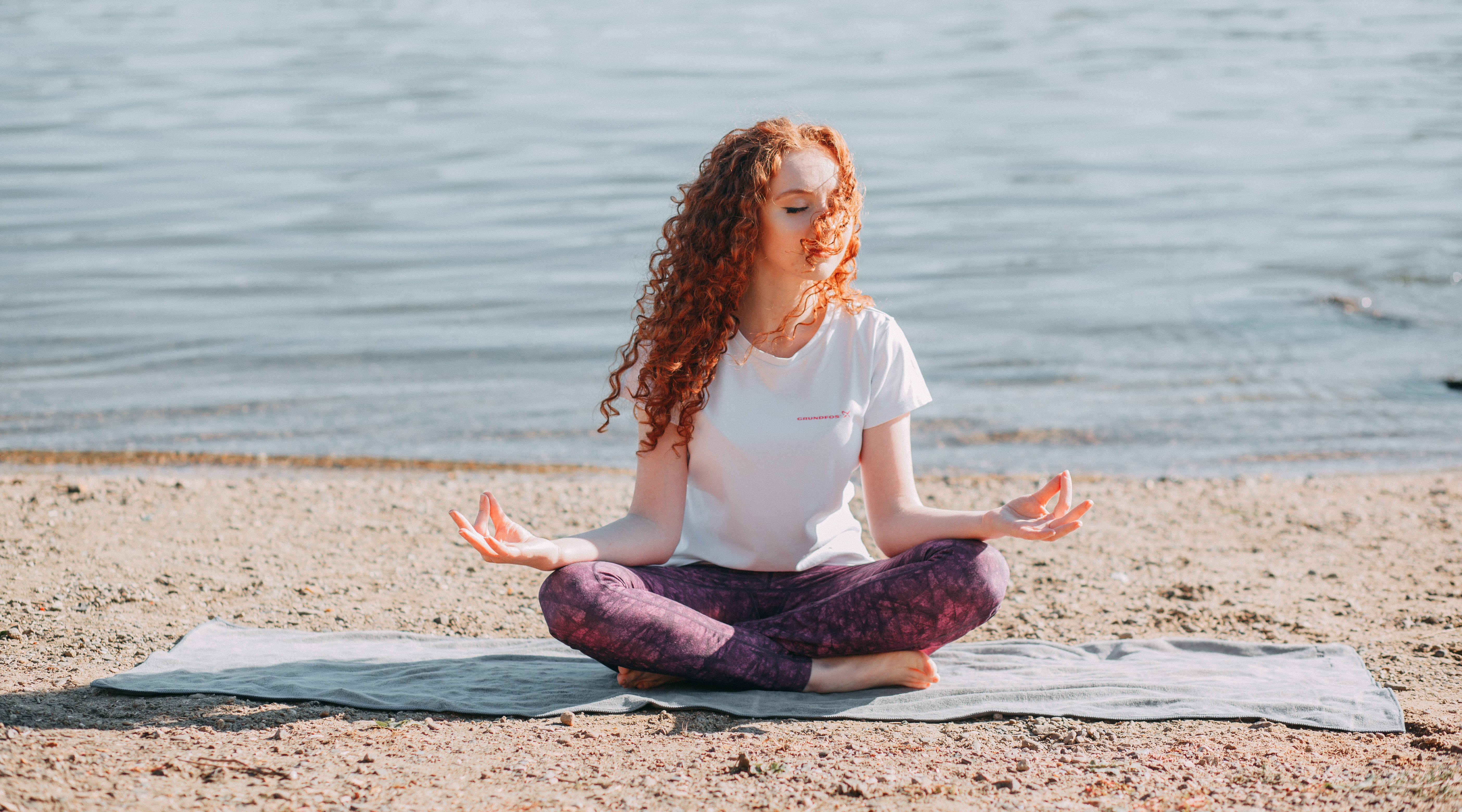 Canva - Woman Doing Yoga Exercise At The Sea Shore