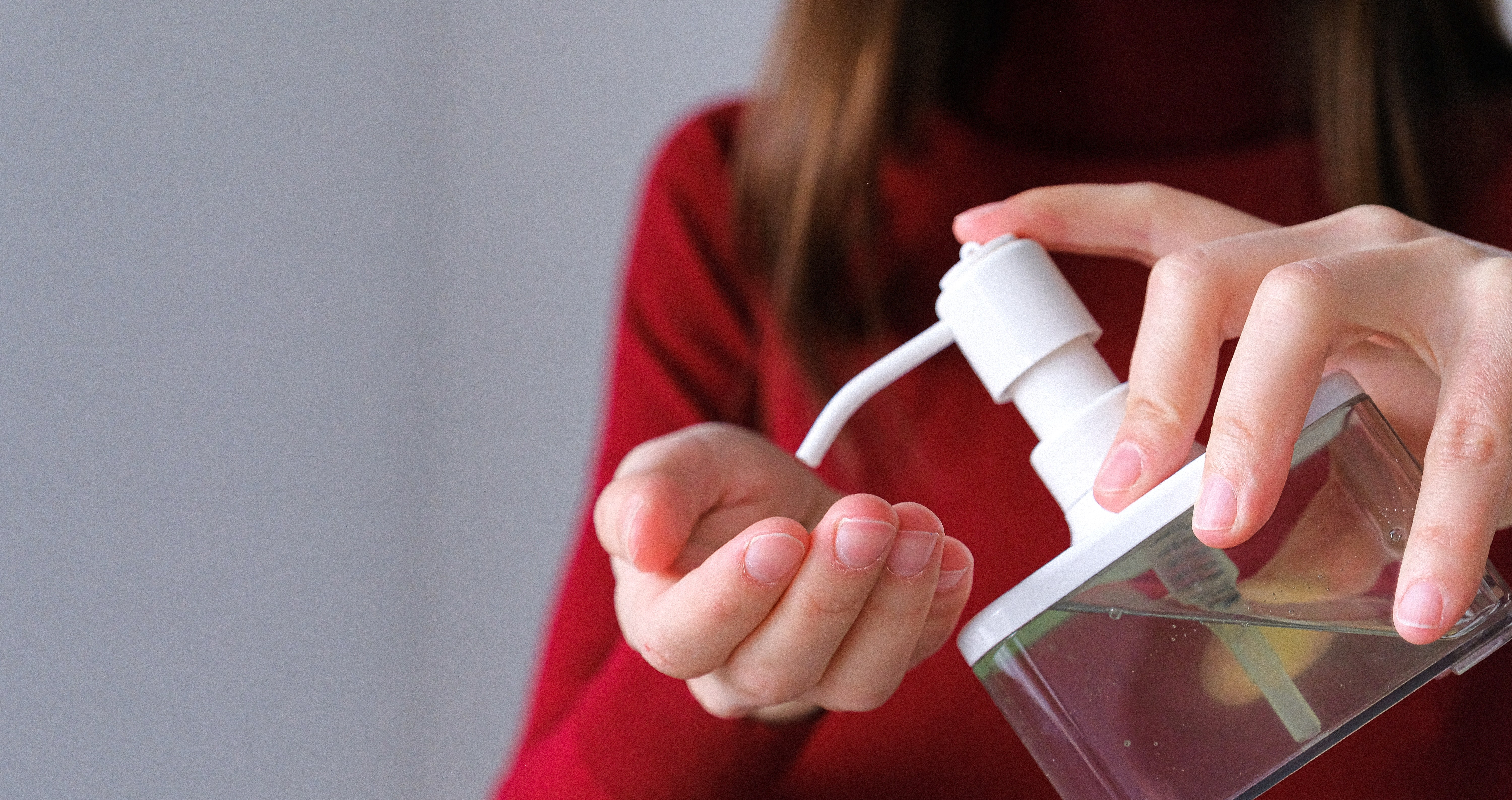 Canva - Woman Applying Hand Sanitizer