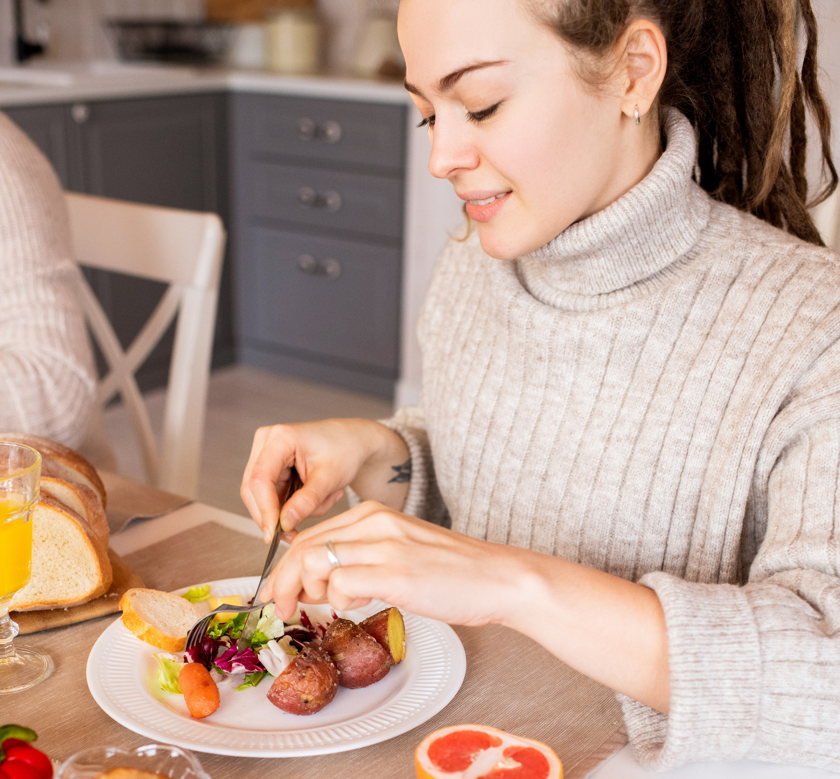 Canva - Woman In A Sweater Eating