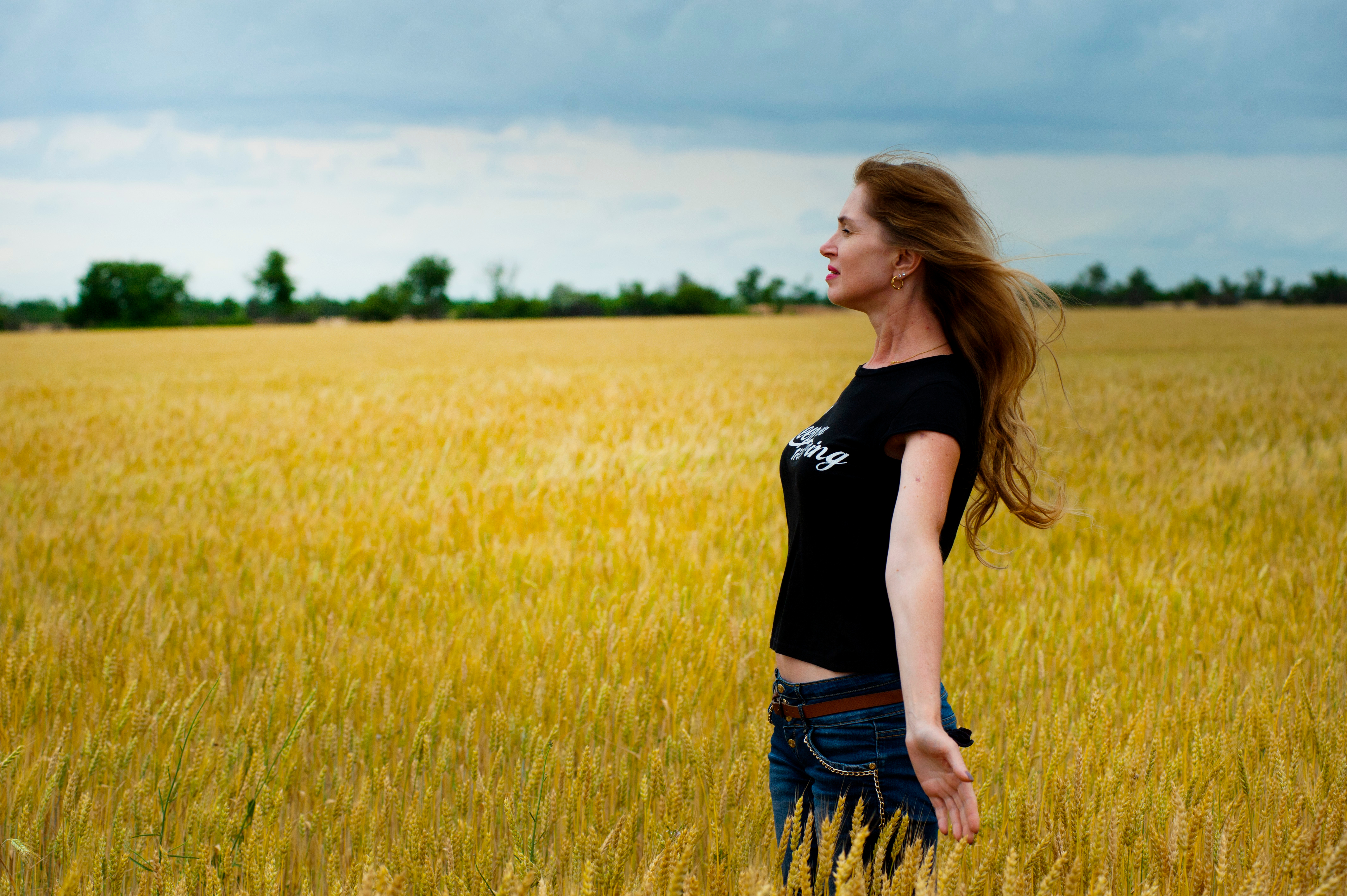 Canva - Woman Wearing Black Shirt Surrounded by Grass