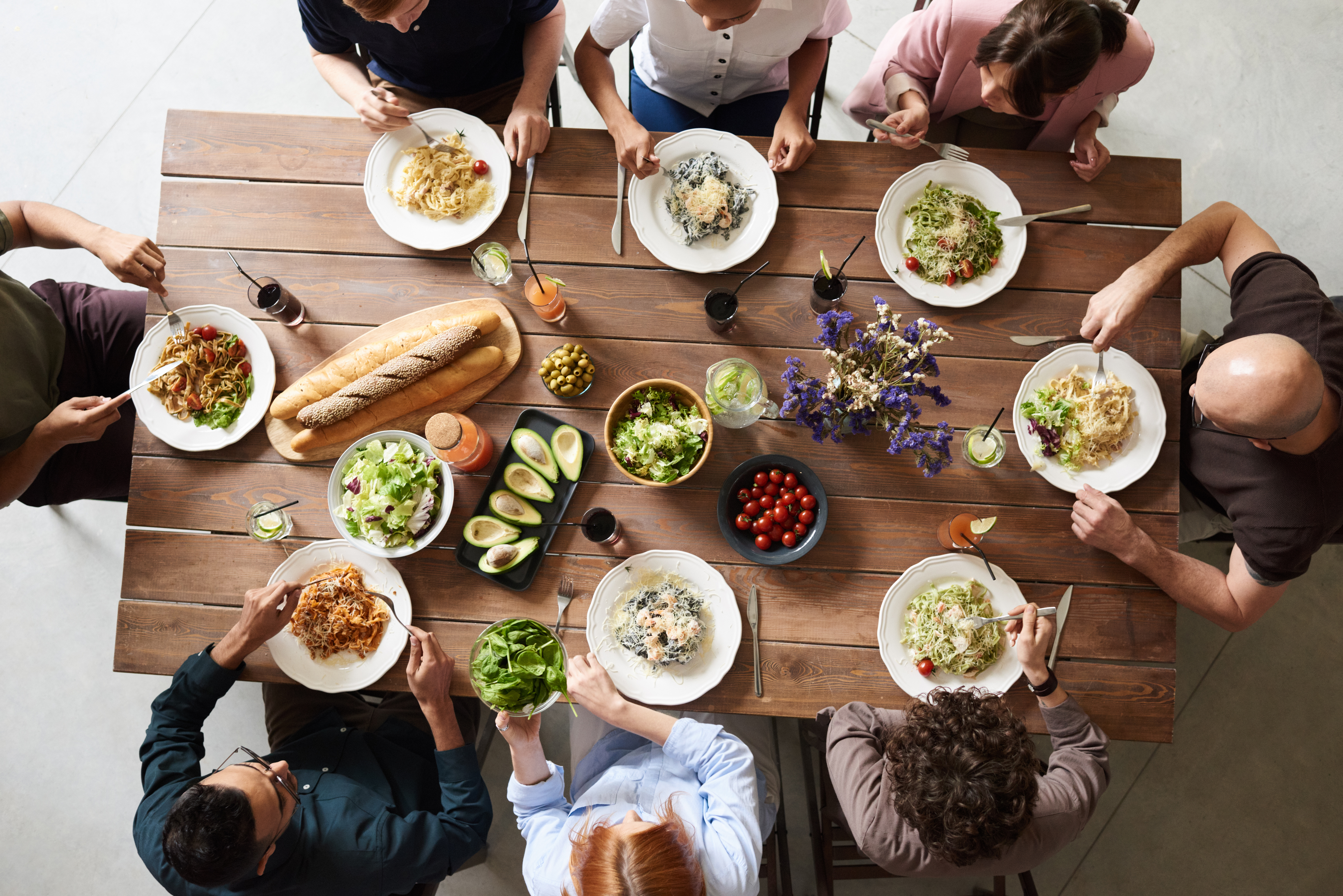 Canva - Group of People Eating Together