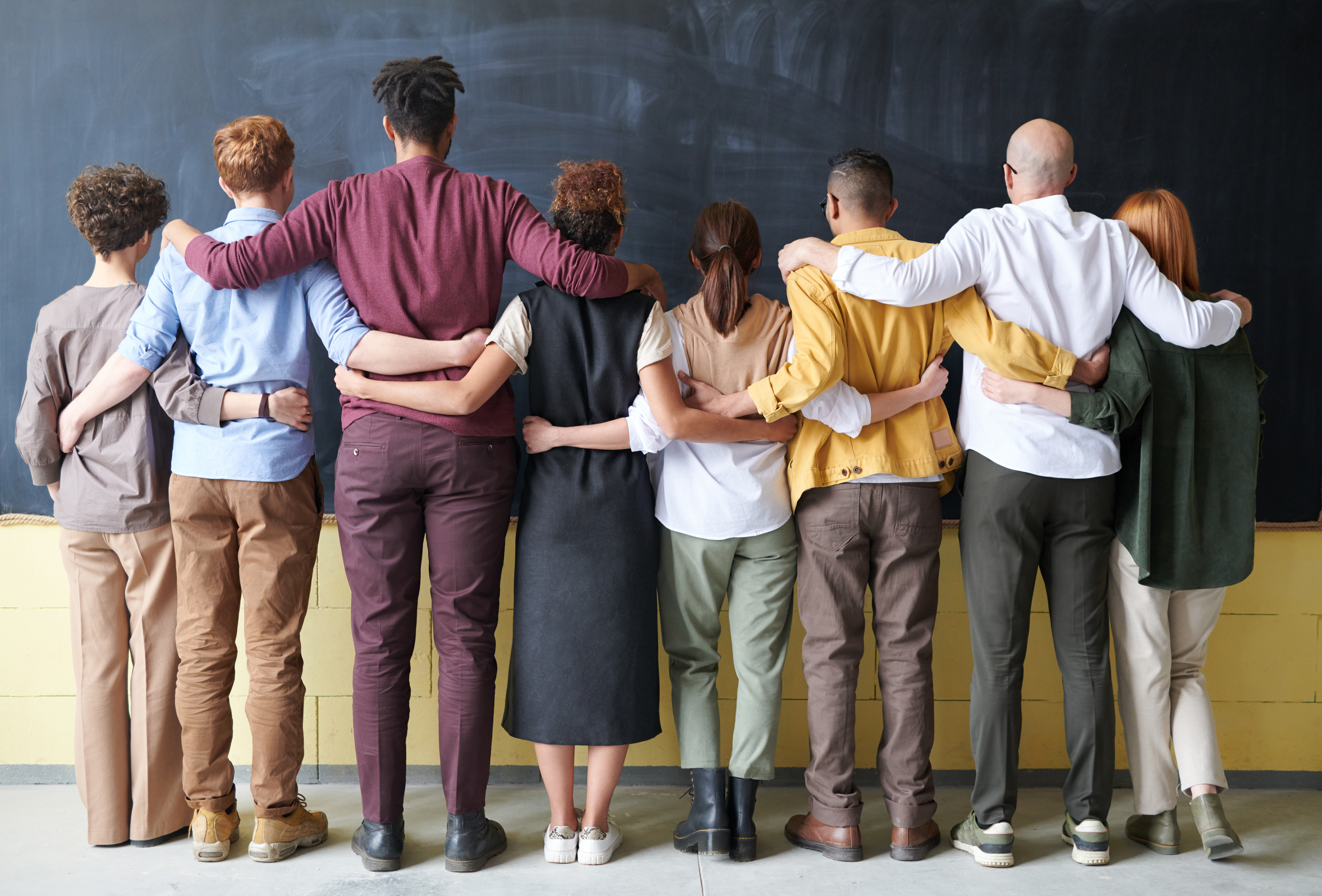 Canva - Group of People Standing Indoors