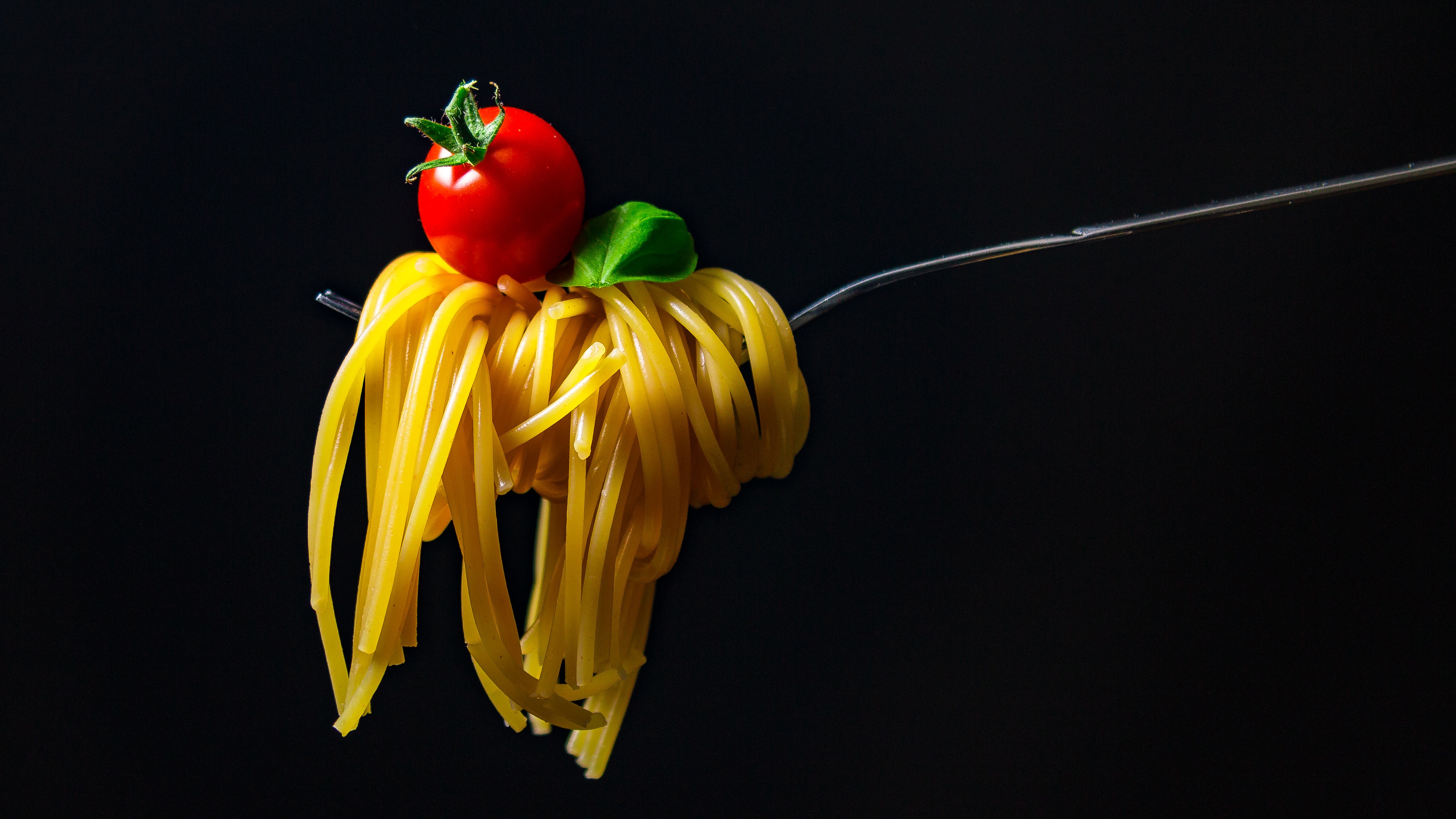 Canva - Fork Holding Pasta and Cherry Tomato