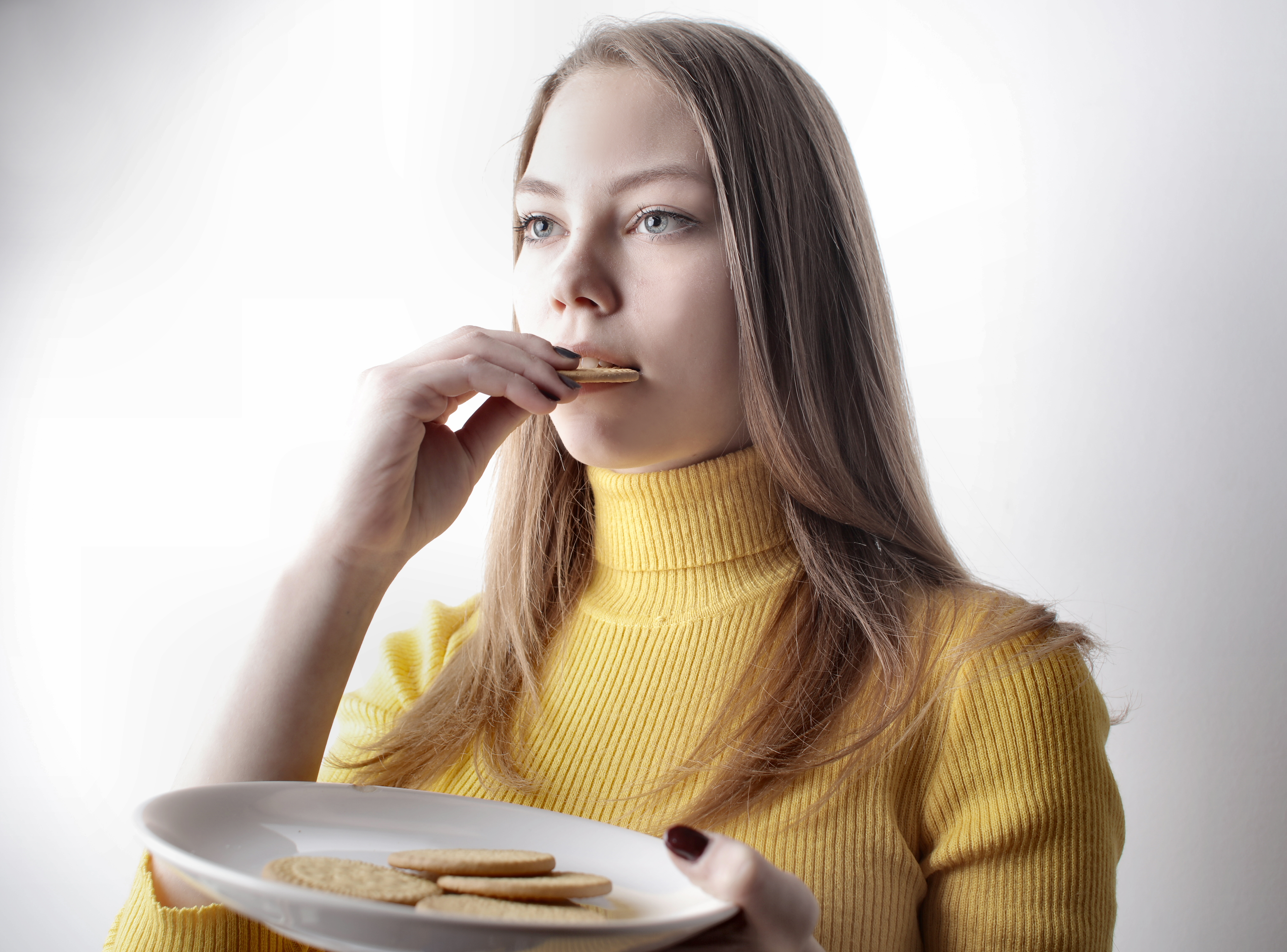 Canva - Woman In Yellow Sweater Holding White Ceramic Plate
