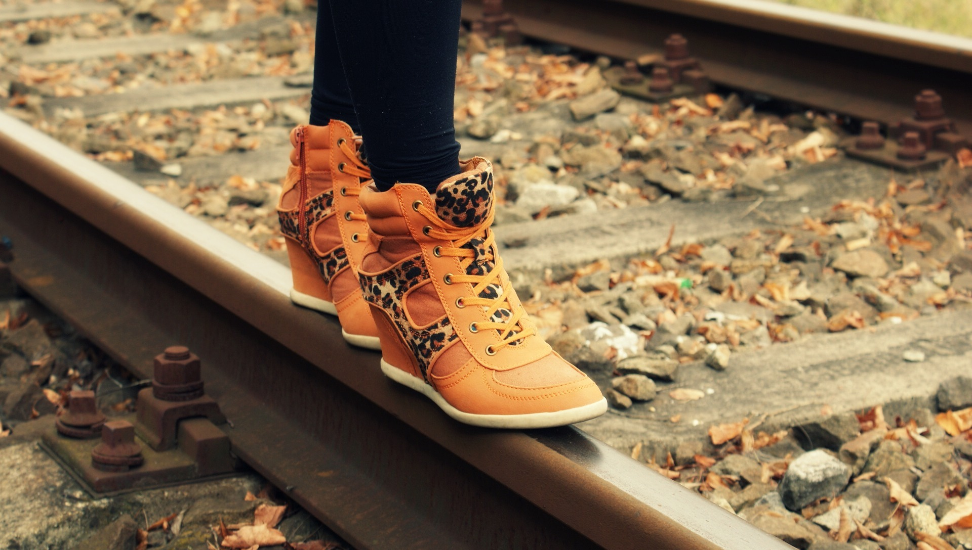Canva - Boots on Railroad Track